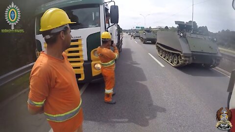 ESCORT ARMOURED VEHICLES IN ROAD