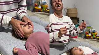 Little Girl Enjoys Face Massage From Her Dad