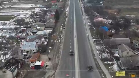 Russian armor taking artillery fire outside Kiev.