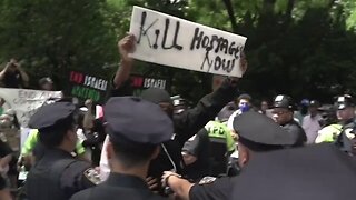 Masked Protester Taunts New York City Israel Day Parade With "Kill Hostages Now" Sign