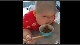 KID EATING NOODLES