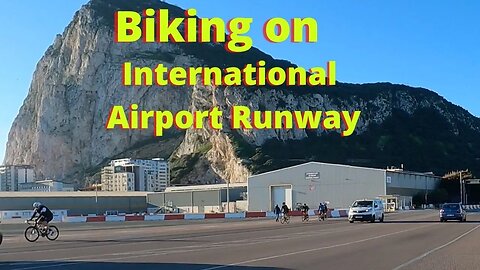 Airport Runway Gibraltar: Riding Bike on Runway