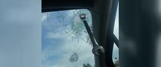 Wrench slams through woman's windshield