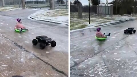 Kid gets pulled by high-powered RC truck on icy road