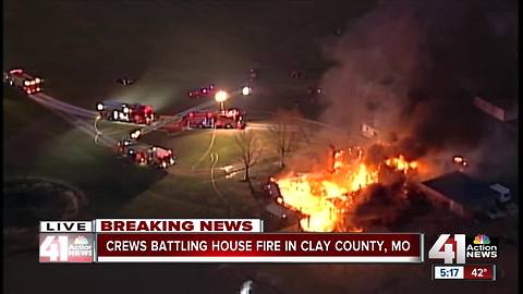 Crews battle large house fire in rural Clay County