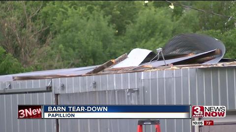 Group working to salvage barn damaged by storm