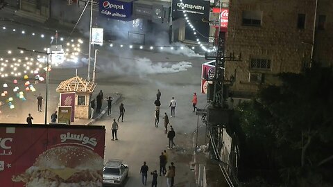 People in West Bank city of Jenin run as raid underway