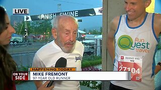 Runners Mike Fremont and Harvey Lewis prepare for the Flying Pig Toyota 10K