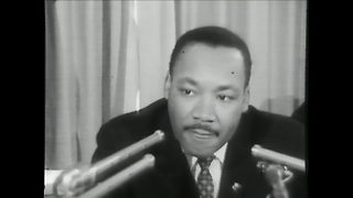 Martin Luther King Jr. speaks at a news conference at the Milwaukee Auditorium