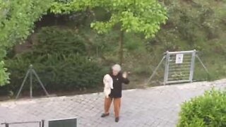 Lady takes her dog for a dance