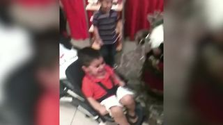 "A Baby Boy In A Stroller Screams When He Sees Santa Doll"