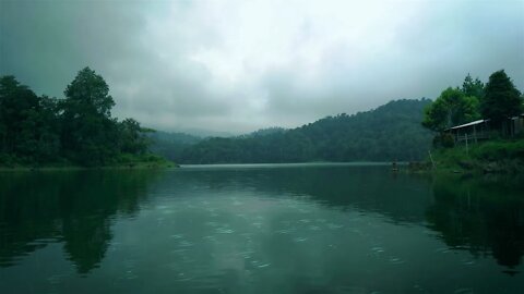 Gentle rain on a lake on a cloudy day