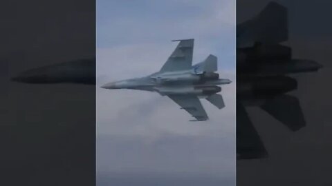 Russian Su- 27 follows A Cruise Missile over water