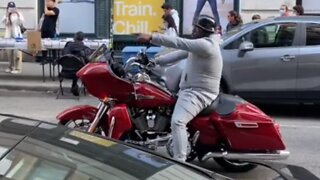 NYC man on motorcycle sings his heart out