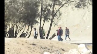 Reporter at Border Films Cartel Members with Automatic Weapons Crossing into US