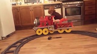 Toddler Takes Naps On Toy Train