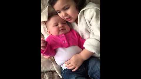 Big Sister Stops Baby From Crying By Singing To Her
