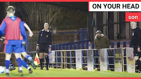 David Beckham spotted standing alone in a shabby stand at a football ground