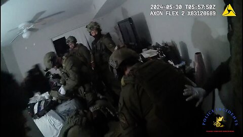 Body-cam footage of SWAT officers shooting a man who was armed inside an apartment with his mother