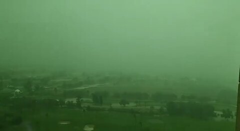 Dubai's sky transforms to green amidst intense rain and thunderstorms in the UAE