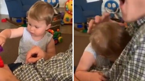 Little girl completes the puzzle & bites her dad out of surprise