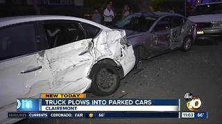 Truck plows into parked cars
