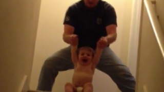 Dad Plays With His Toddler Making Martial Arts Sounds