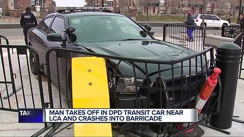 Man takes off in police transit car and crashes into barricade