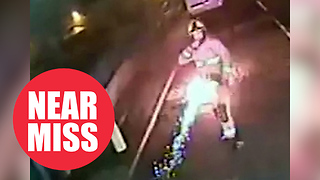 Shocking CCTV shows moment firework misses firefighter by inches after being thrown at him