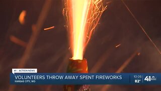 Volunteers throw away spent fireworks