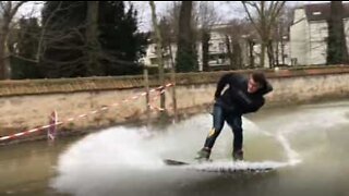 Parisians practice wakeboarding in flooded city