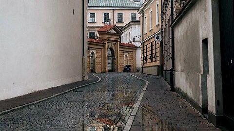 Rain on the cobblestoned Poselska Street near Saint Joseph's Sanctuary in Krakow, Poland