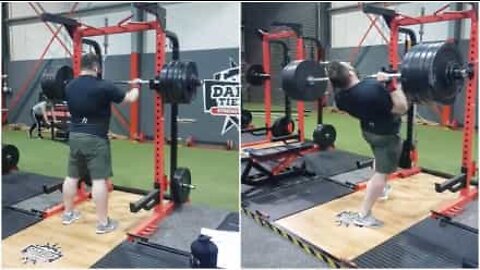 Strongman falls backwards doing overhead press