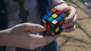 Incredible! Young man uses magic to solve Rubik's Cube