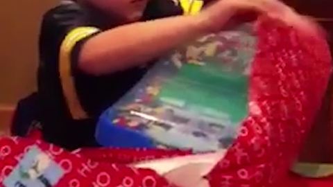 Young Boy Opens A Birthday Present And Finds LEGO!
