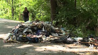 A mountain of trash blocking roadway