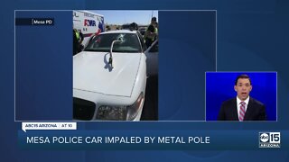 Mesa police vehicle impaled by metal pole