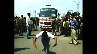 Guy Pulls Bus With Hair