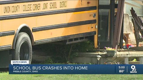 School bus with 30+ students crashes into home