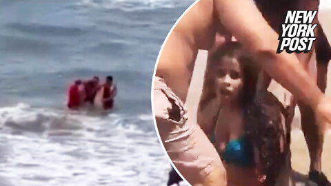 Idiot swims in shark-infested waters where teen's arm was bitten off