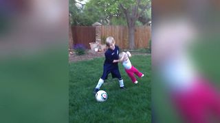Boy Teaches Sister How To Play Soccer