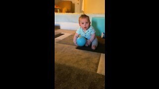 Baby plays ball