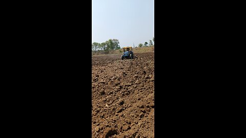 farmer plowing field