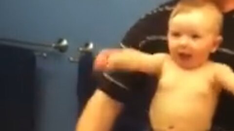 Cute Baby Show muscles with his Dad