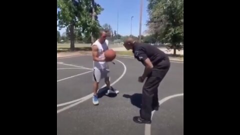 Black cop viciously beats white guy at basketball