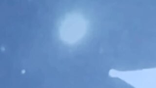 very large sphere UFO flashes back