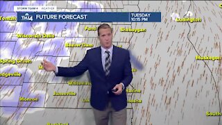 Mostly cloudy, breezy, and warmer Tuesday