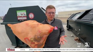 Orange bags of hard-to-recycle plastics used to make lumber