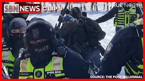 CANADIAN POLICE OFFICER APPEARS TO BEAT PROTESTER WITH BACK OF RIFLE - 6055