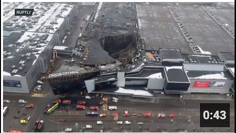 🇷🇺 "Crocus". Aerial view. The collapsed roof at the fire site is clearly visible.